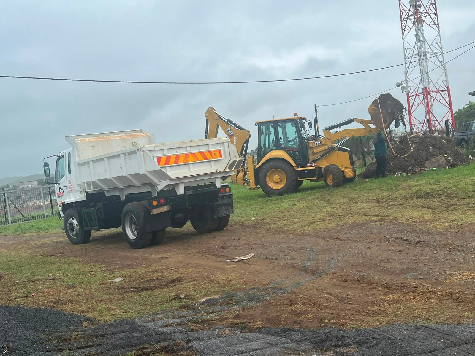 TLB and tipper truck combination on a civils site in Northern KZN
